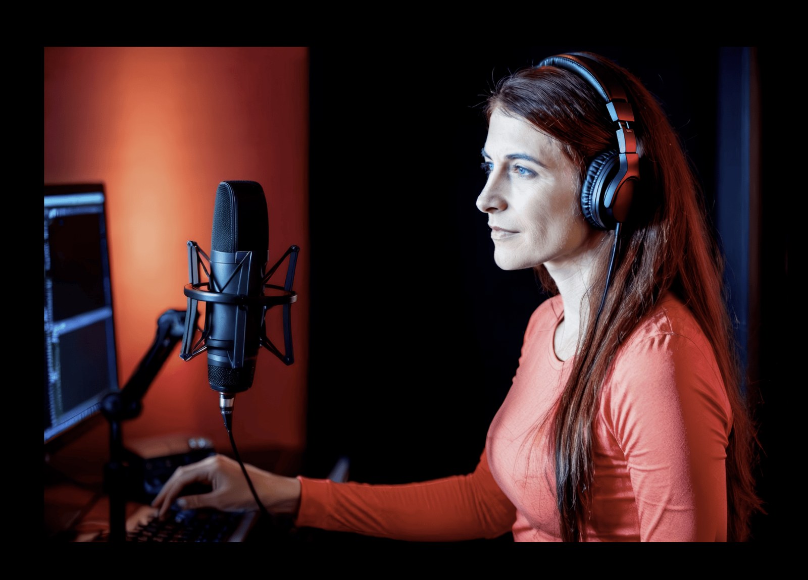 Katrin Liebermann in her recording studio with headphones and microphone